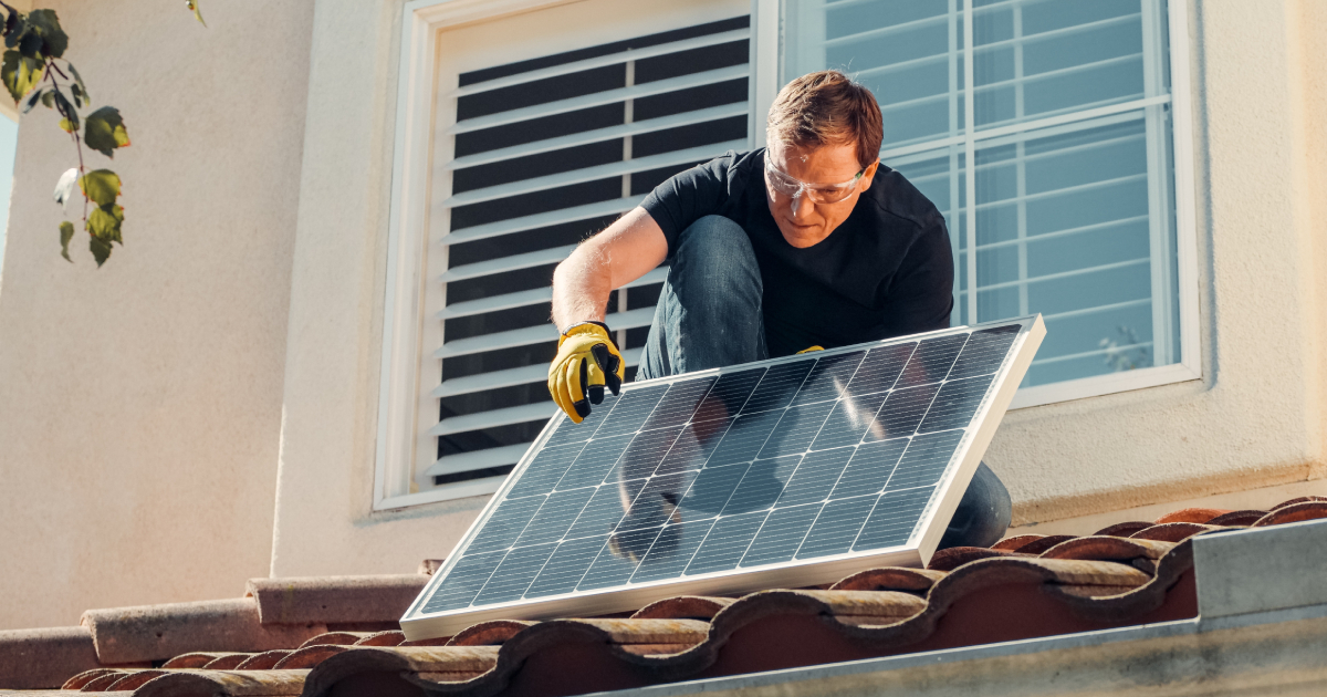 Man placing solar panel