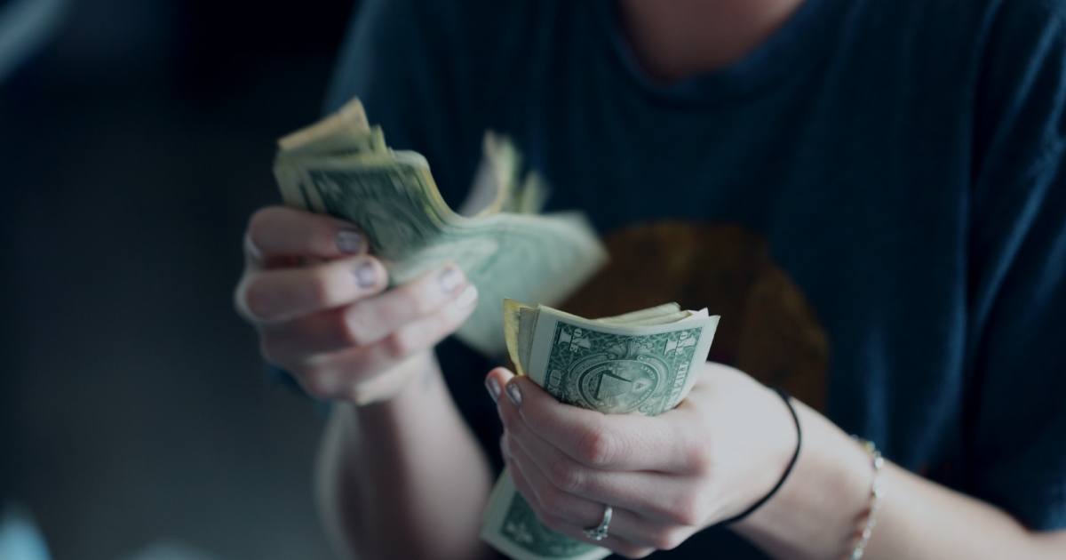 Woman counting dollars