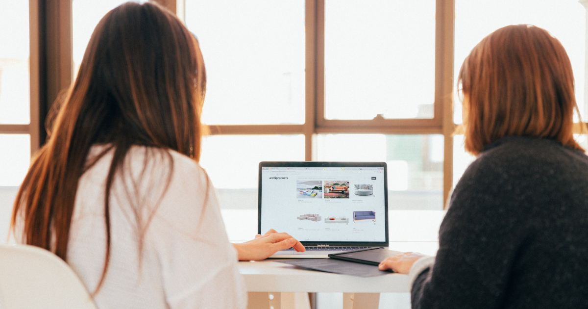 Two girls browsing eCommerce store